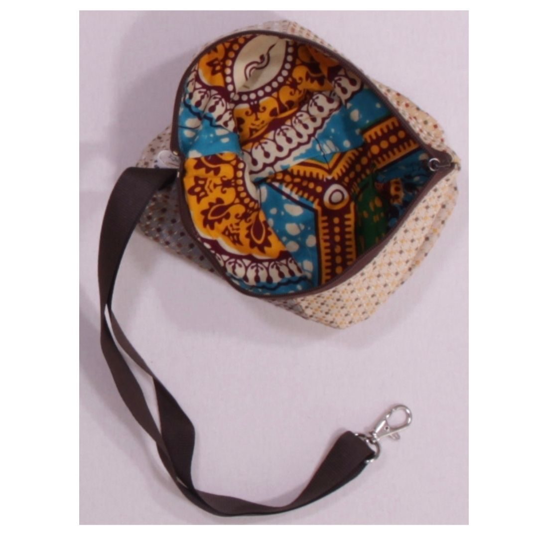 anna * pollack, Täschchen beige mit Bändchen, afrikaprint türkis gefüttert, mit Zipp und Gurt